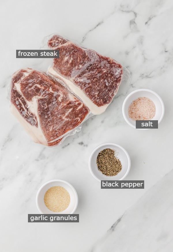 frozen steak ingredinets on a counter.