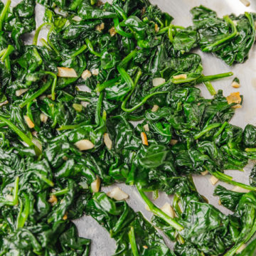 garlic sauteed spinach in a skillet.