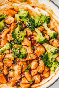teriyaki chicken in a skillet with broccoli