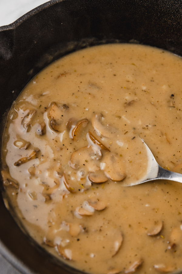 ladle in a pan of mushroom gravy.