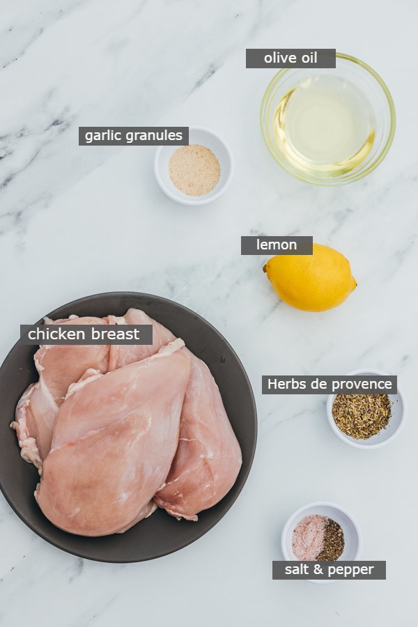 ingredients to make matinated chicken breast on the counter.