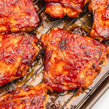 Baked bbq chicken thighs on a wire rack