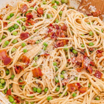 pasta and bacon in a skillet.