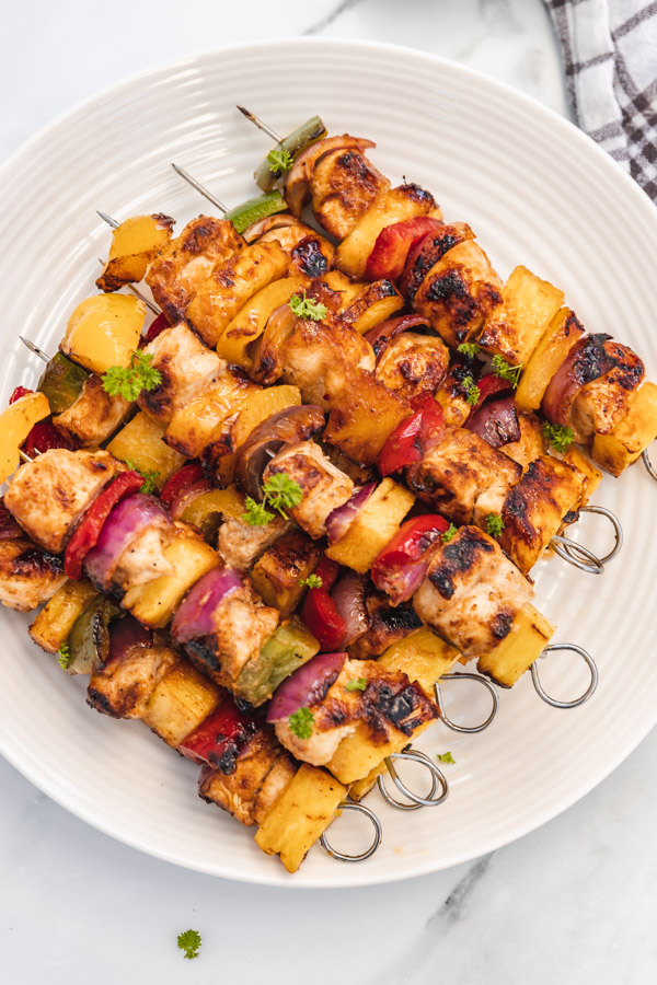 grilled chicken pineapple kebab on a plate.