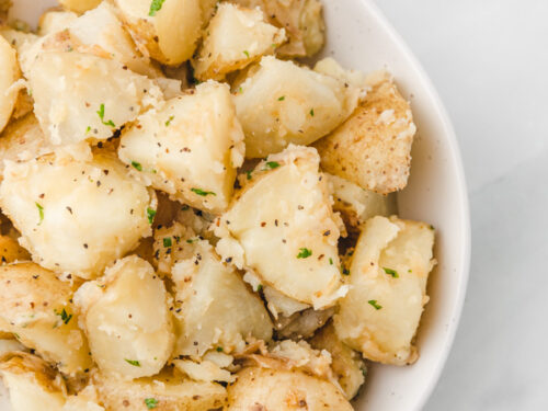 buttered potatoes in a serving dish.