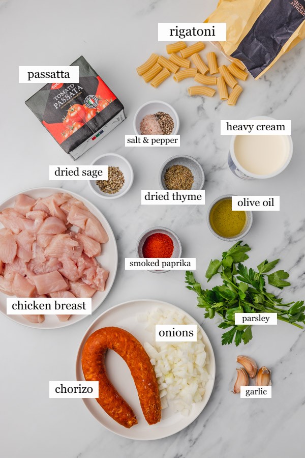 ingredients needed to make pasta on a marble surface.