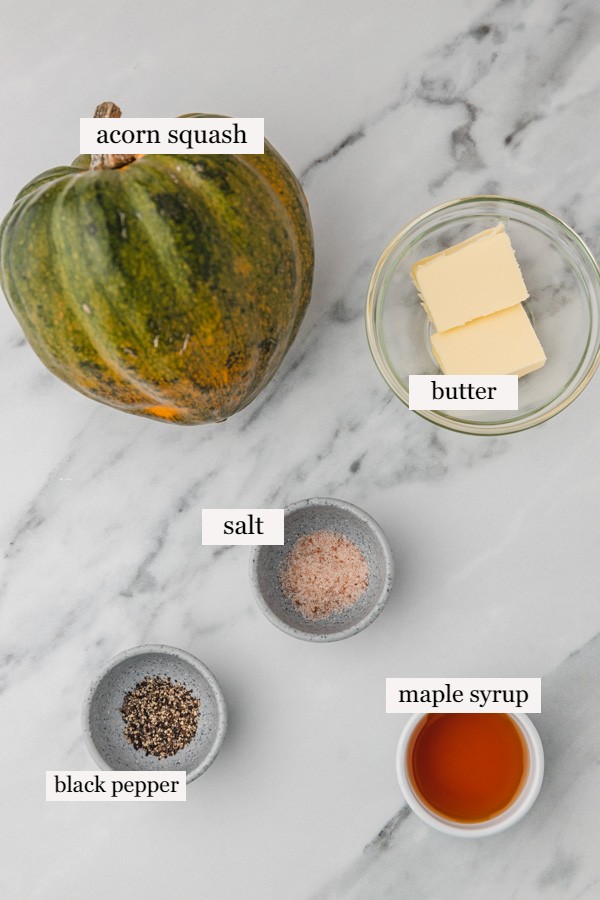 ingredients for air fryer acorn squash on the marble surface.