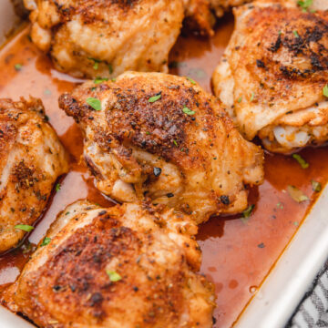 baked chicken thighs in a baking sheet.