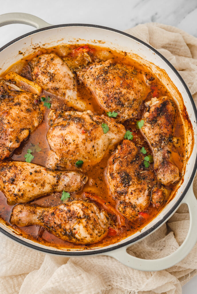 baked chicken and gravy in a dutch oven skillet.