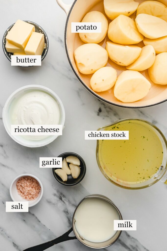 mashed potato ingredients on a marble surface.