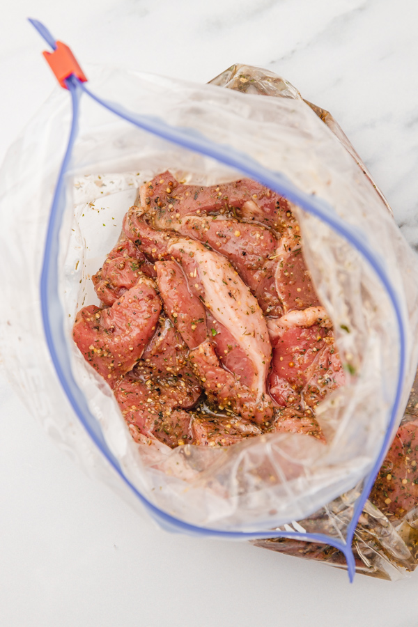 marinated lamb steak in a ziploc bag.