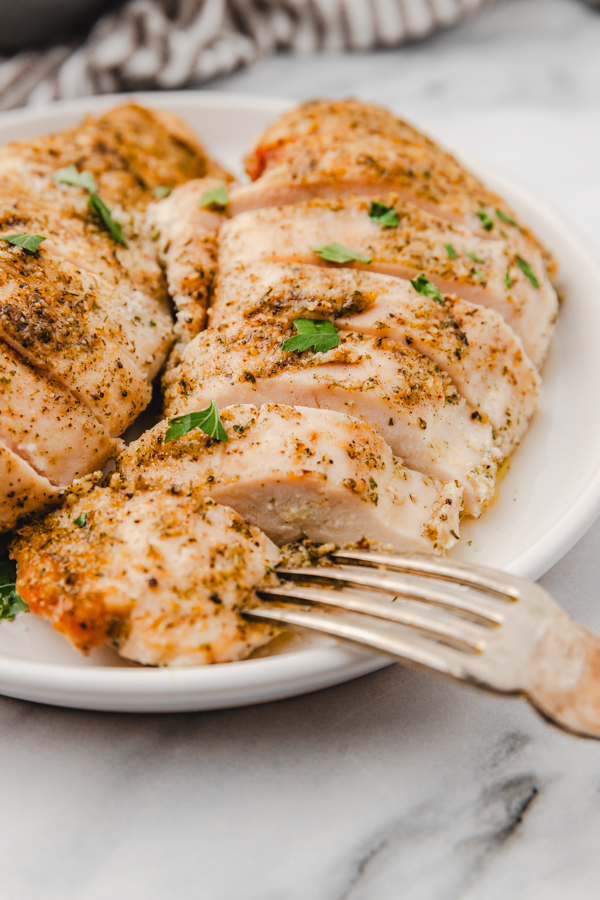 sliced chicken breast on a plate.