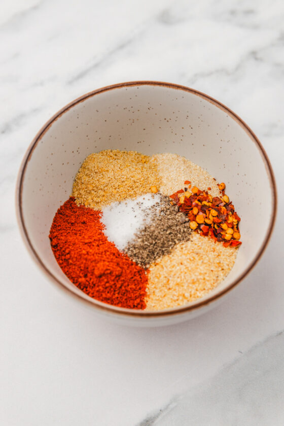 spices in measured into a bowl.