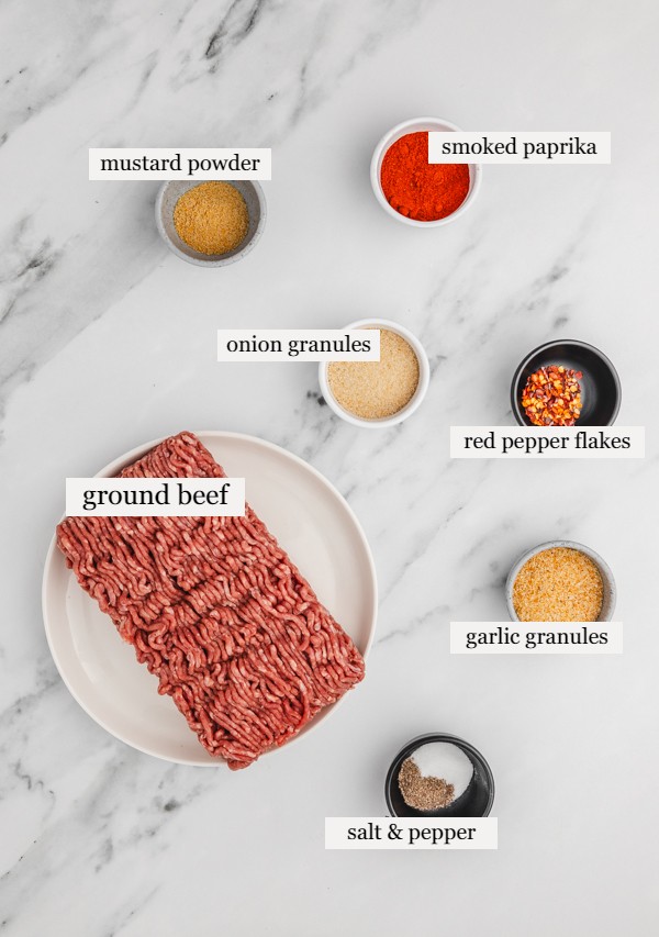 ground beef seasoning ingredients on a marble surface.
