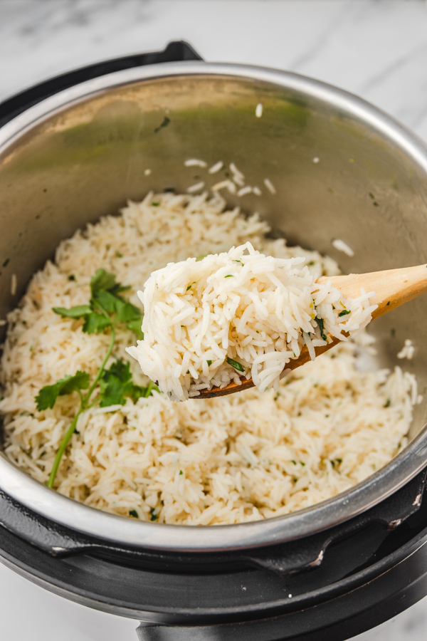 cooked rice on a ladle.