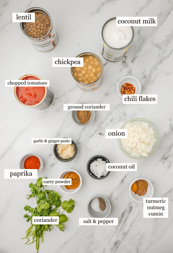 ingredients needed to make curry on a marble surface.