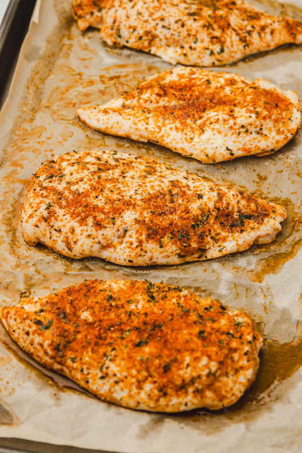 baked chicken breast on a tray.