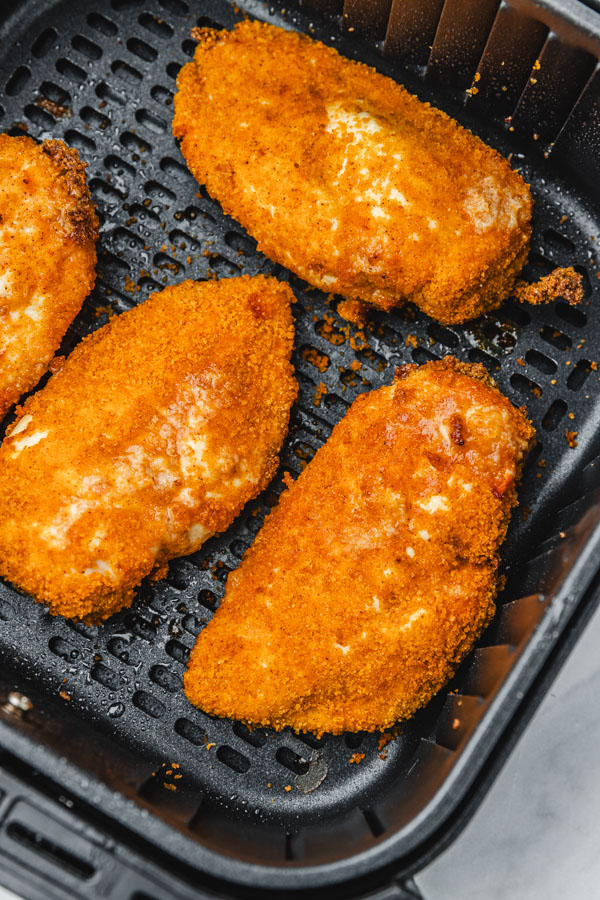 four bake and shake chicken in air fryer basket.