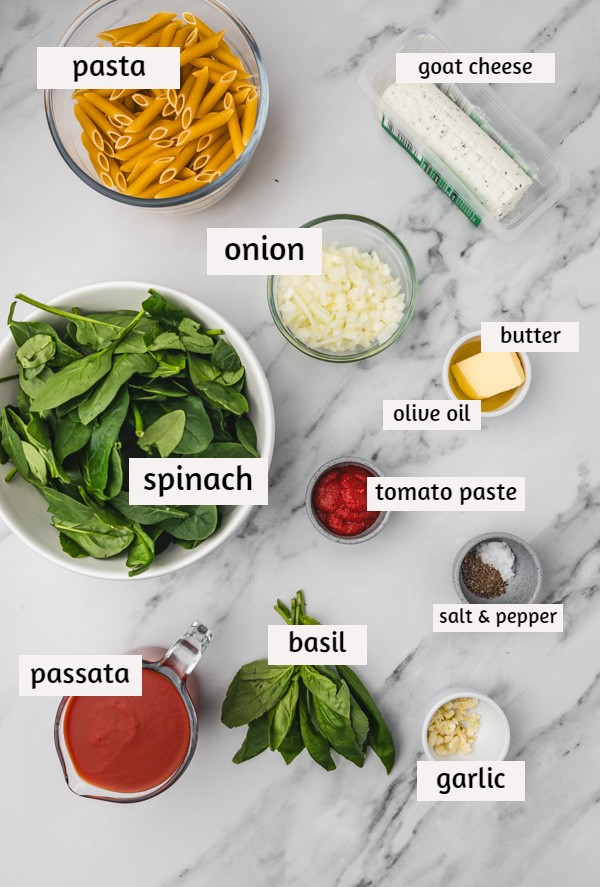 ingredients to make goat cheese pasta on a table.