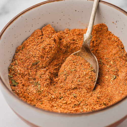 spice blend in a bowl with a spoon.
