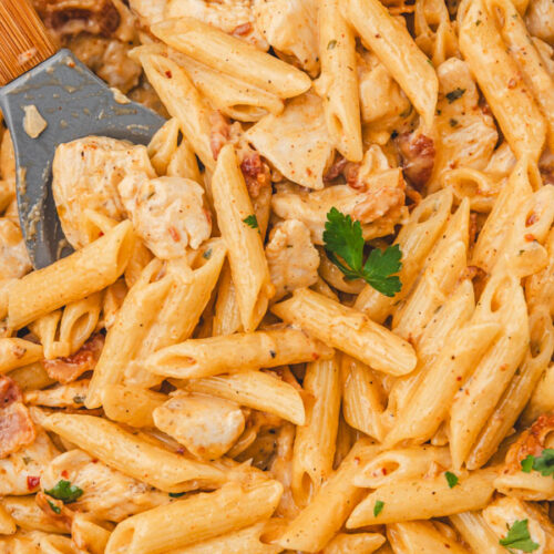 a close up of creamy ranch chicken pasta in a skillet.