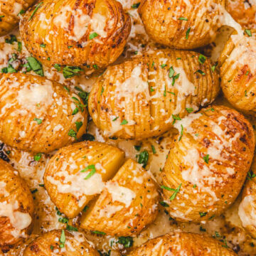 Mini hasselback potatoes in a baking dish.