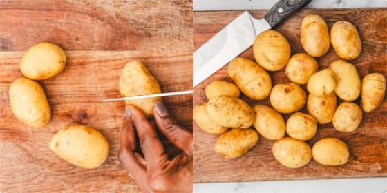 a hand cutting potatoes to make it a hasselback potatoes.