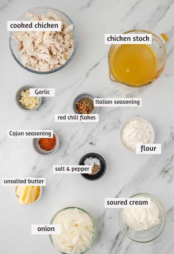 ingredients needed for gravy chicken laid on a white marbles surface.